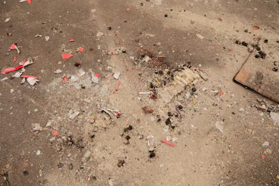Debris and remnants are scattered across the floor.