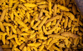 Dried turmeric root is shown.