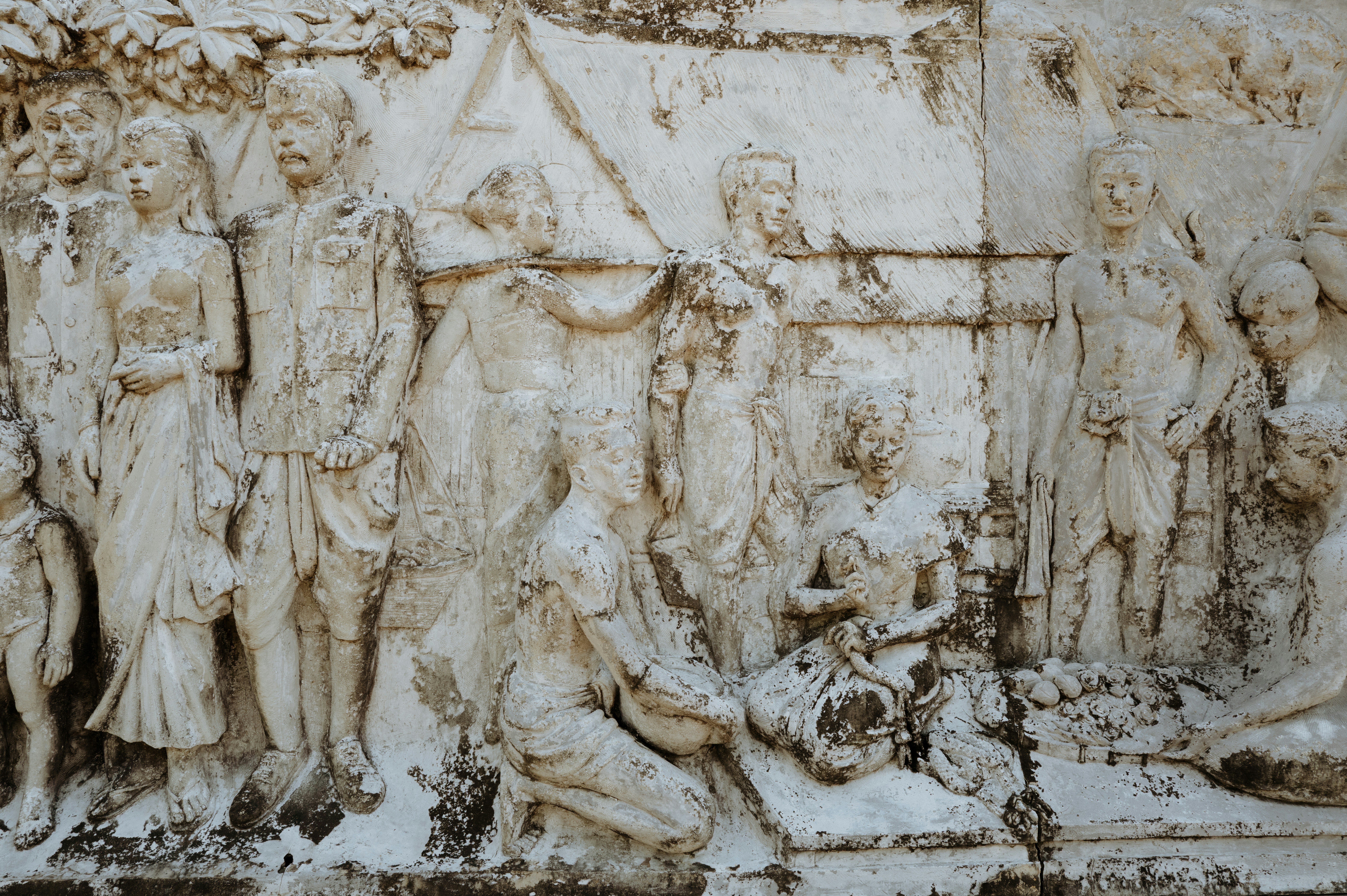 Ancient relief art depicts a historical scene.