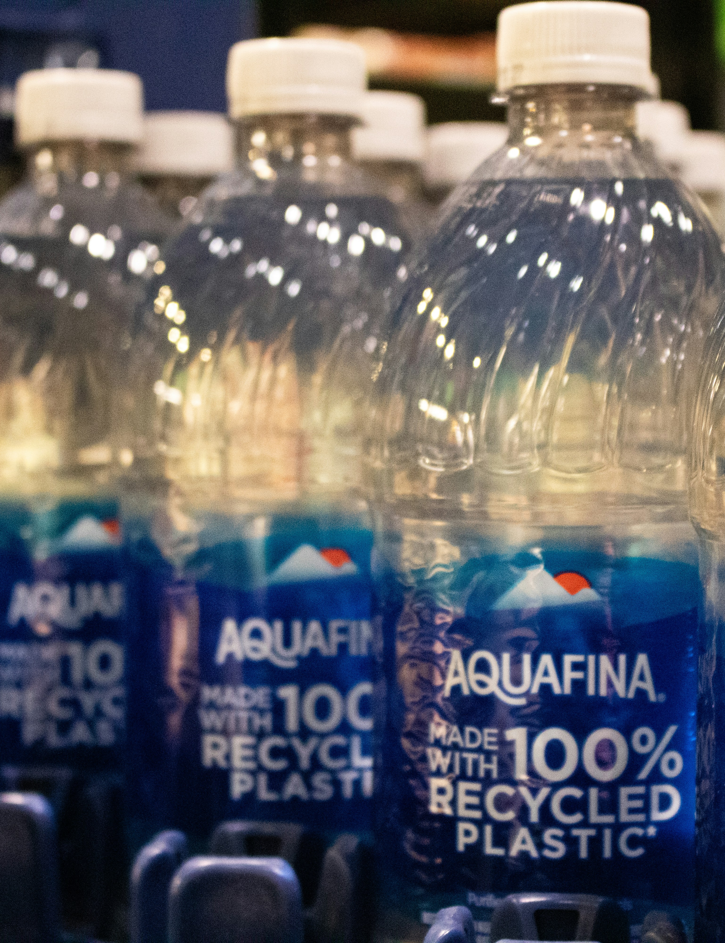 Bottles of aquafina water made with recycled plastic.