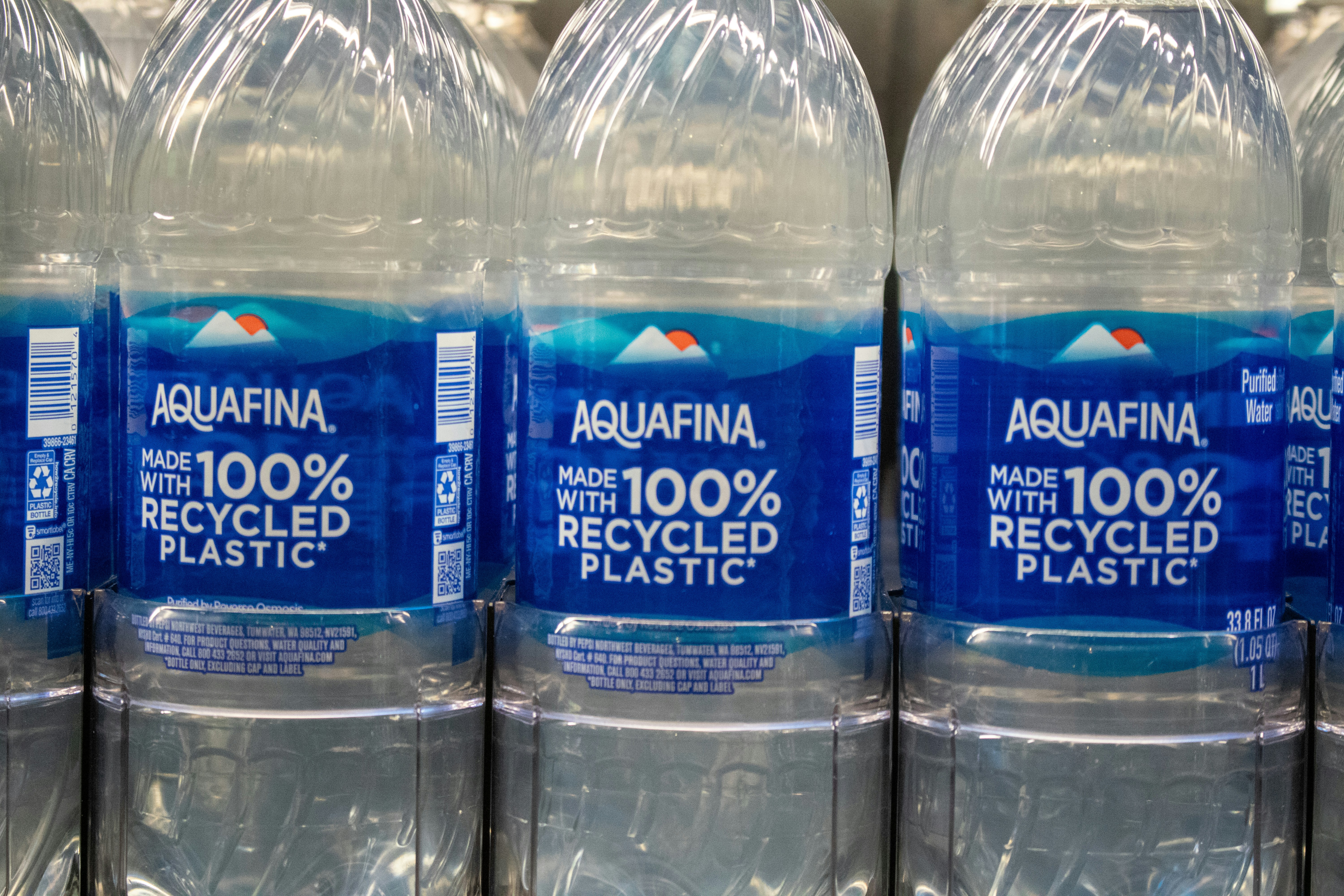 Aquafina bottles are made with recycled plastic. photo - Free ...