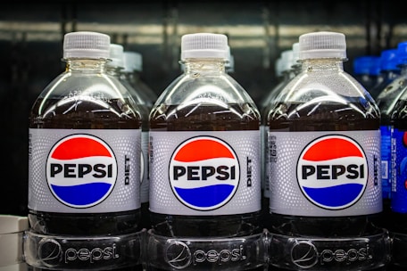 Diet pepsi bottles in a row.