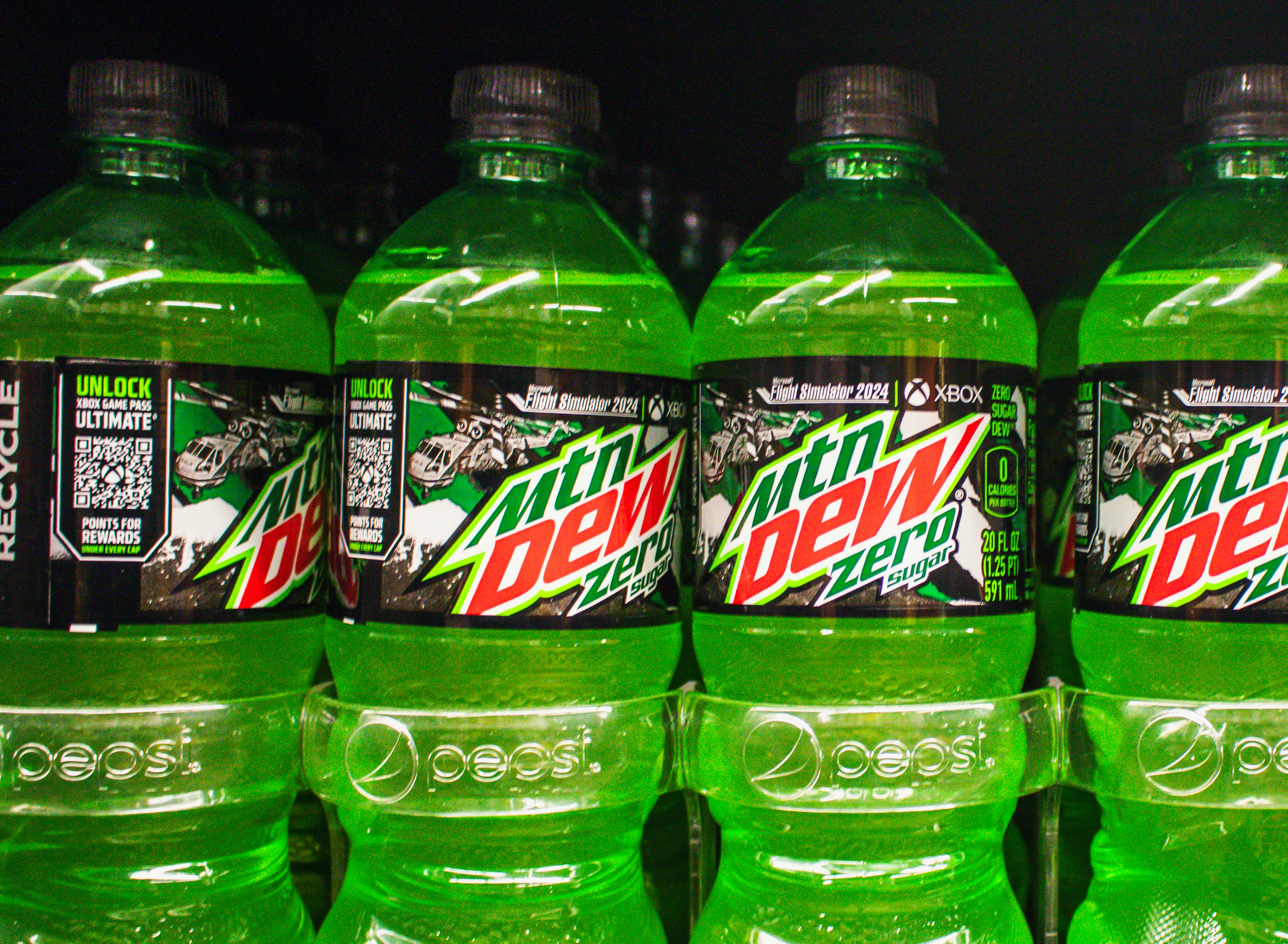 Mountain dew zero bottles on a shelf.