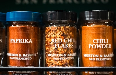 Spices: paprika, red chili flakes, and chili powder.