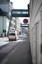 An ambulance travels down a city street.