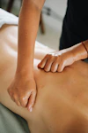 A massage therapist provides a back massage for sports injury in Bowmanville