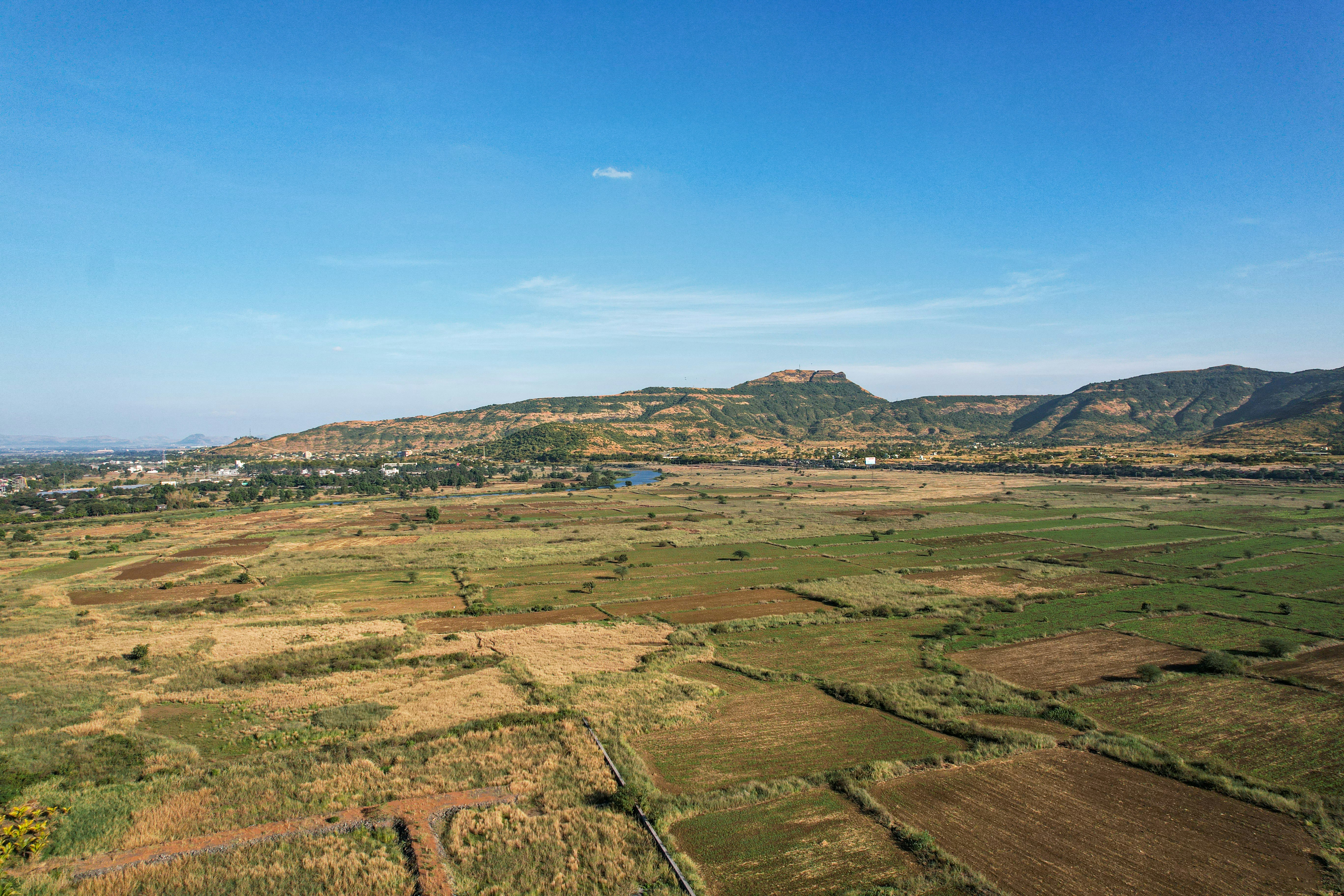 Indian farmlands with mountains
