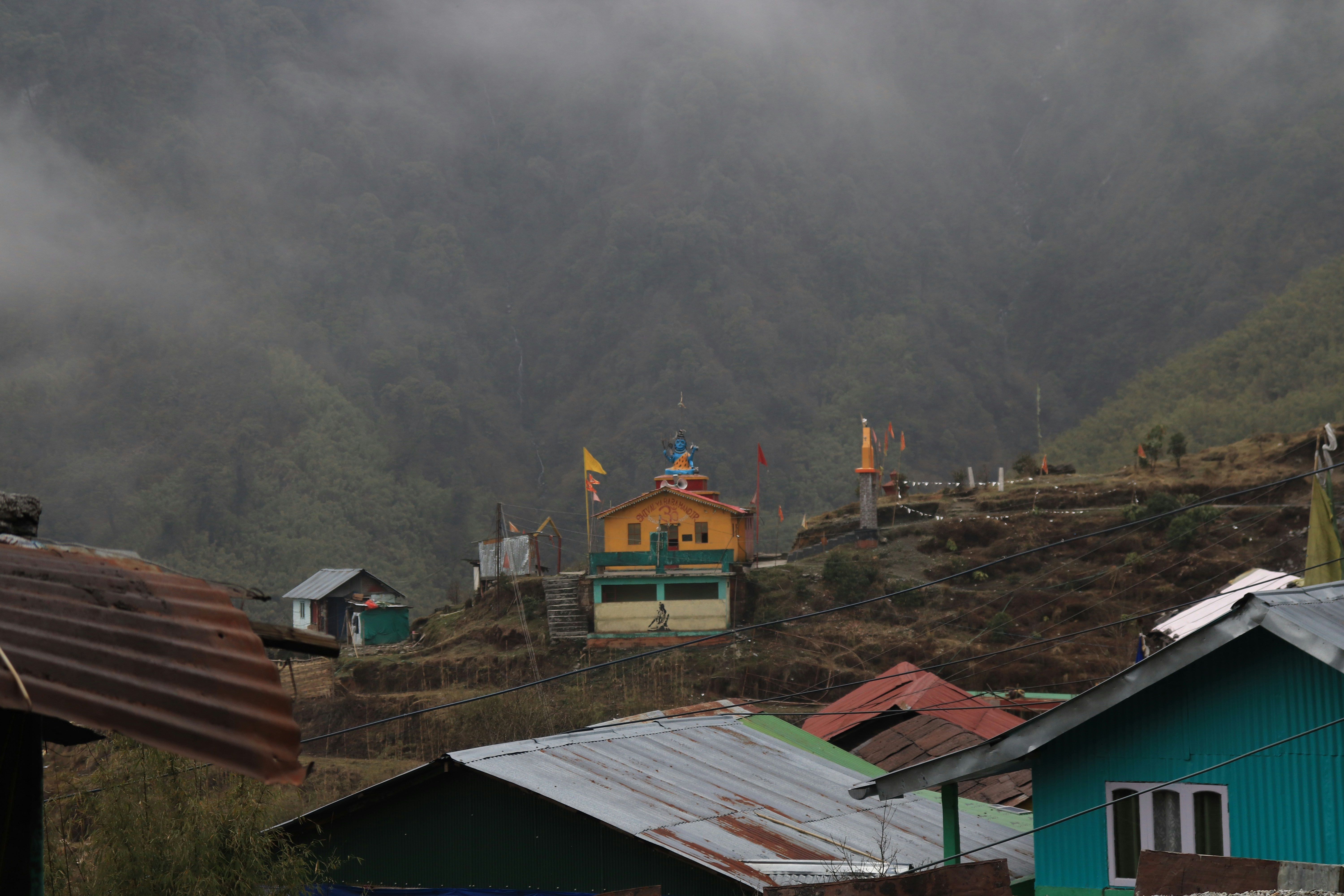 A village nestled against a mountain range