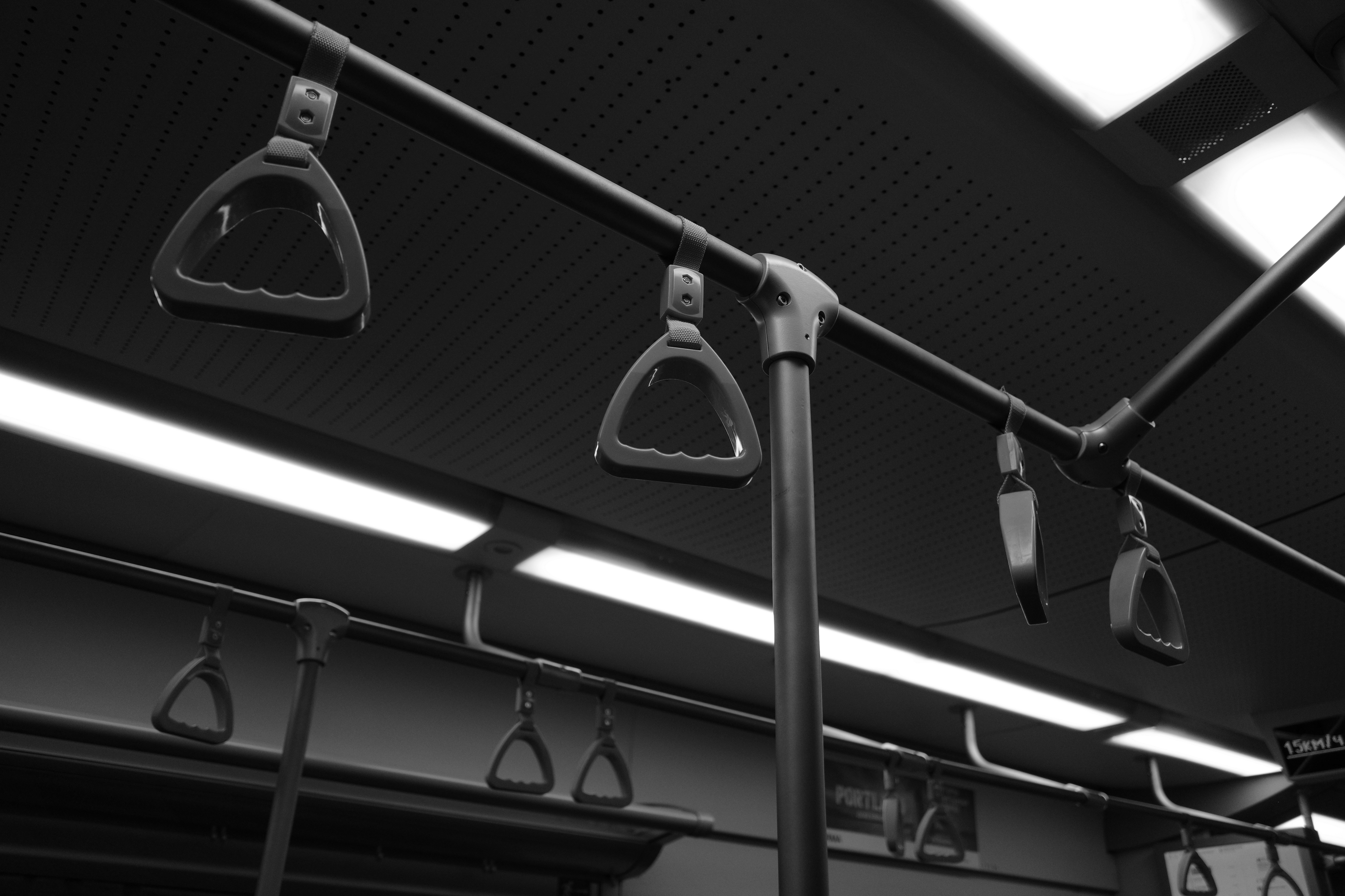 Handles inside a subway train car. (Photo by Erbol Zhakenov on Unsplash)