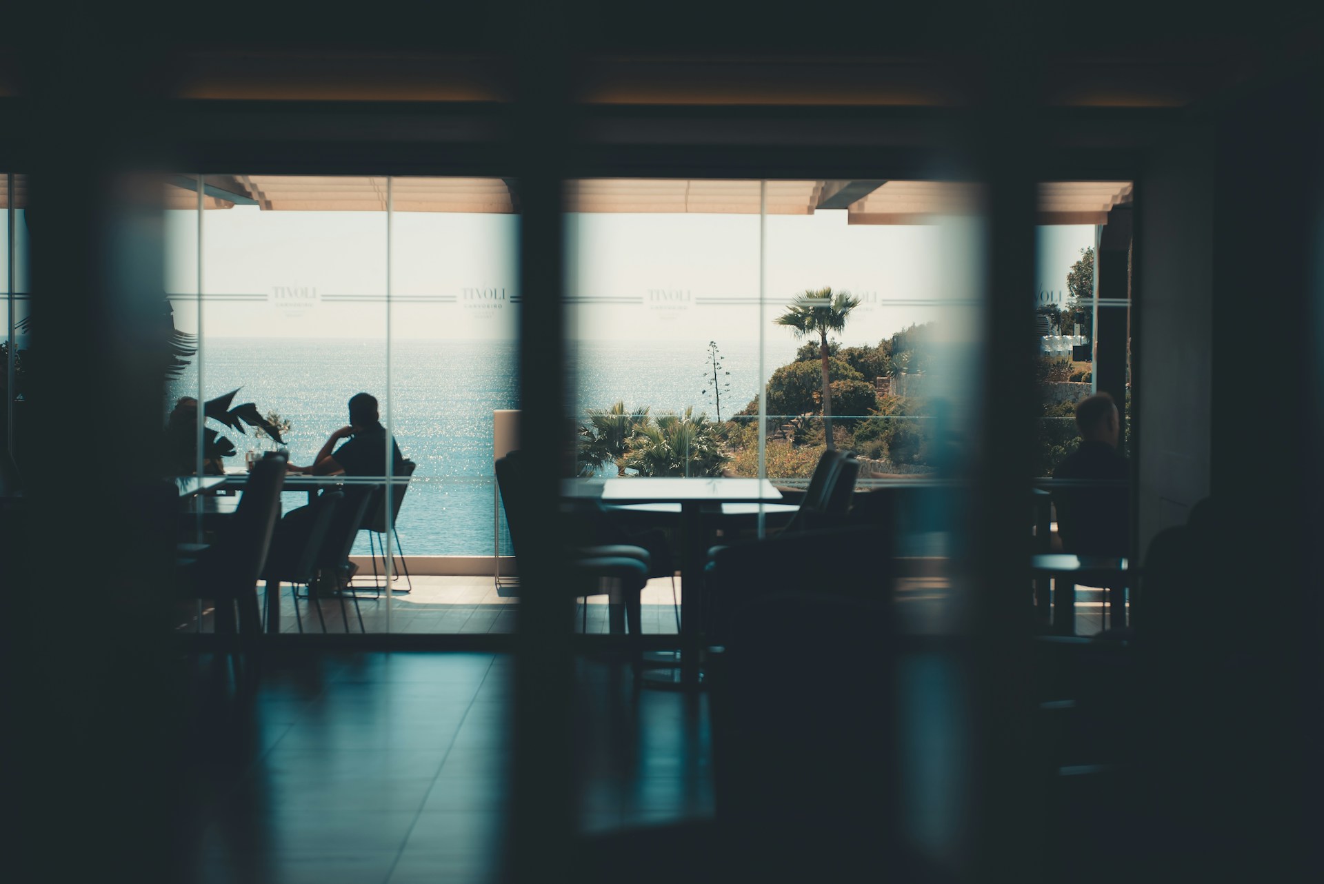 Dining room with a scenic, outdoor ocean view.