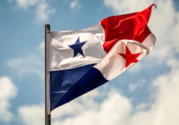 The flag of panama waves in the wind.