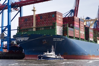 A cargo ship at the harbor's edge.