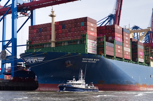 A cargo ship at the harbor's edge.