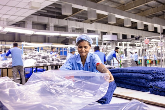 Workers sort clothes in a textile factory.