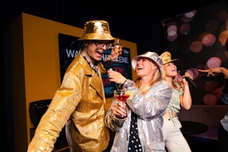 People are partying and singing karaoke with microphones.