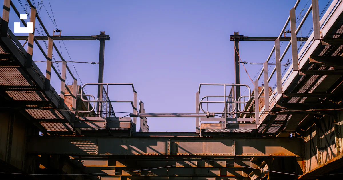 Overhead Railing View Overhead view of train tracks and safety rails. photo – Free Building ...