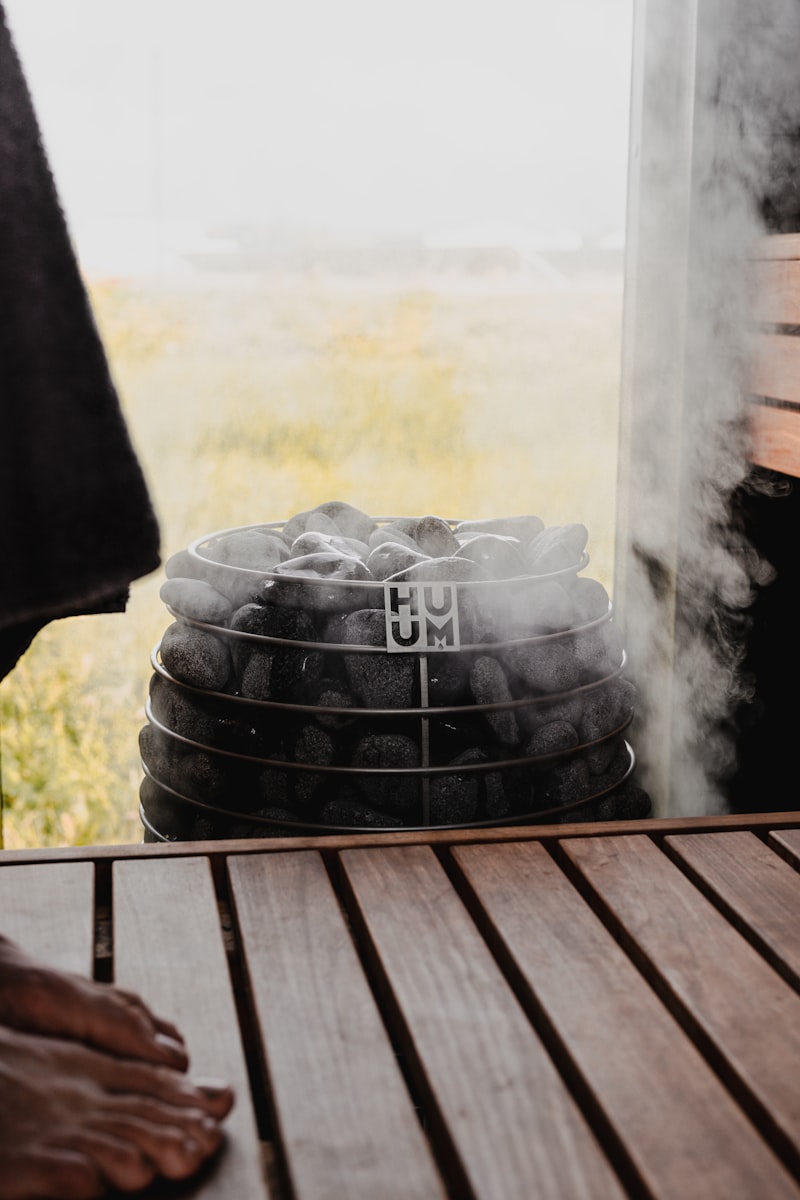 Steam rising from hot rocks in a Finnish sauna