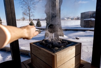 Water is poured on hot sauna rocks.