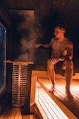 Man enjoys a steamy sauna experience.