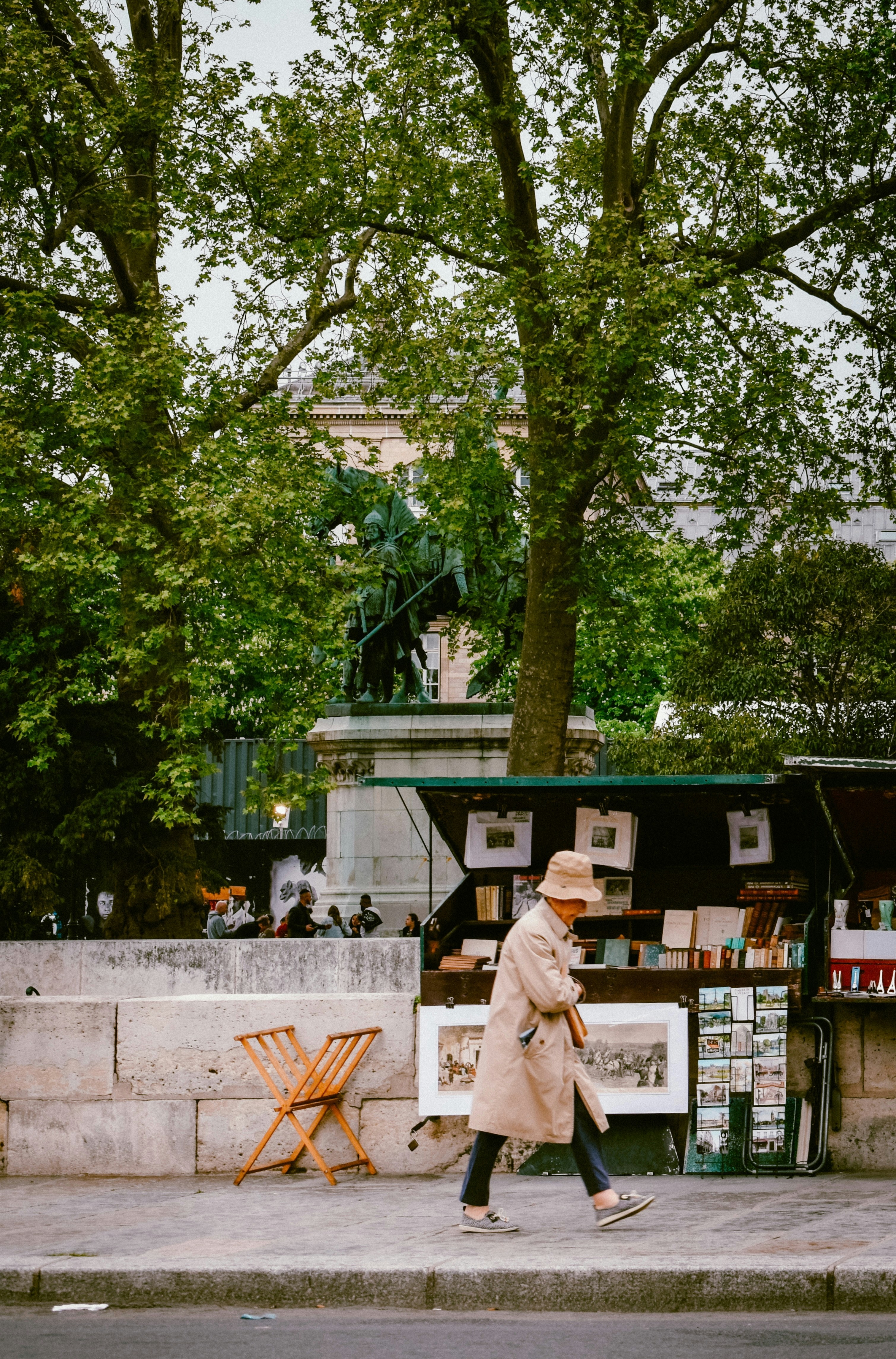 A person walks past a parisian bookstore.