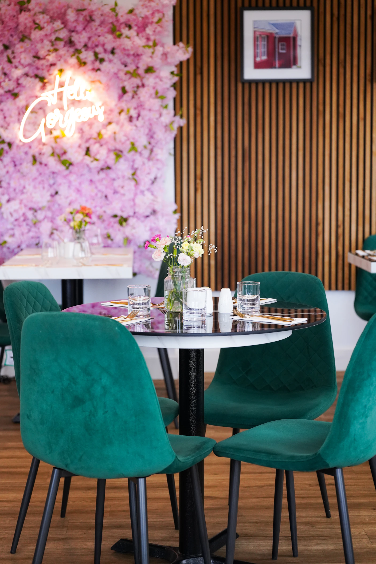 A cozy cafe table set with floral decor and a warm dining atmosphere