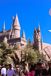 Hogwarts castle towers over a crowd.