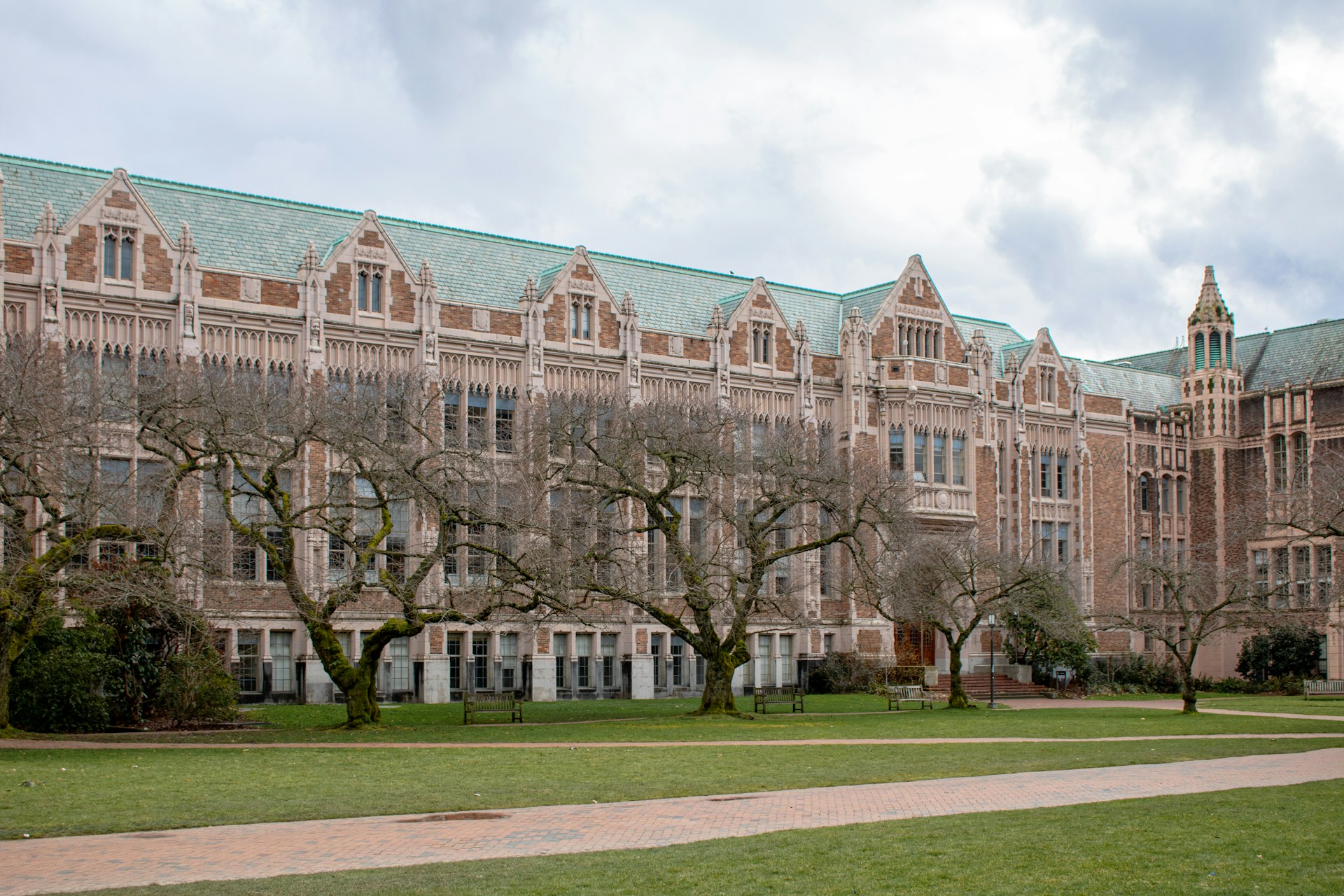 A large brick building with a green roof.