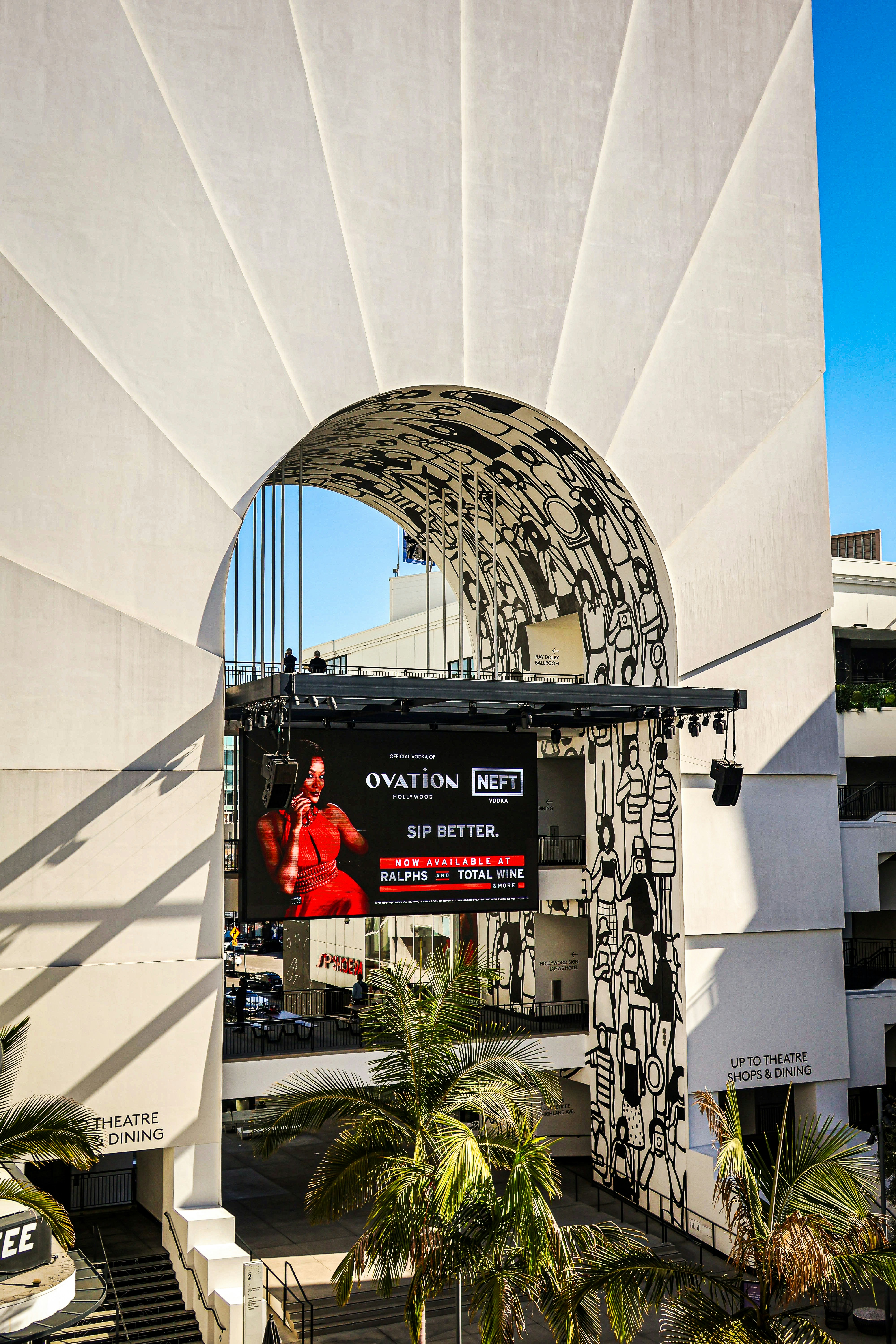 Modern building with an ad display and archway