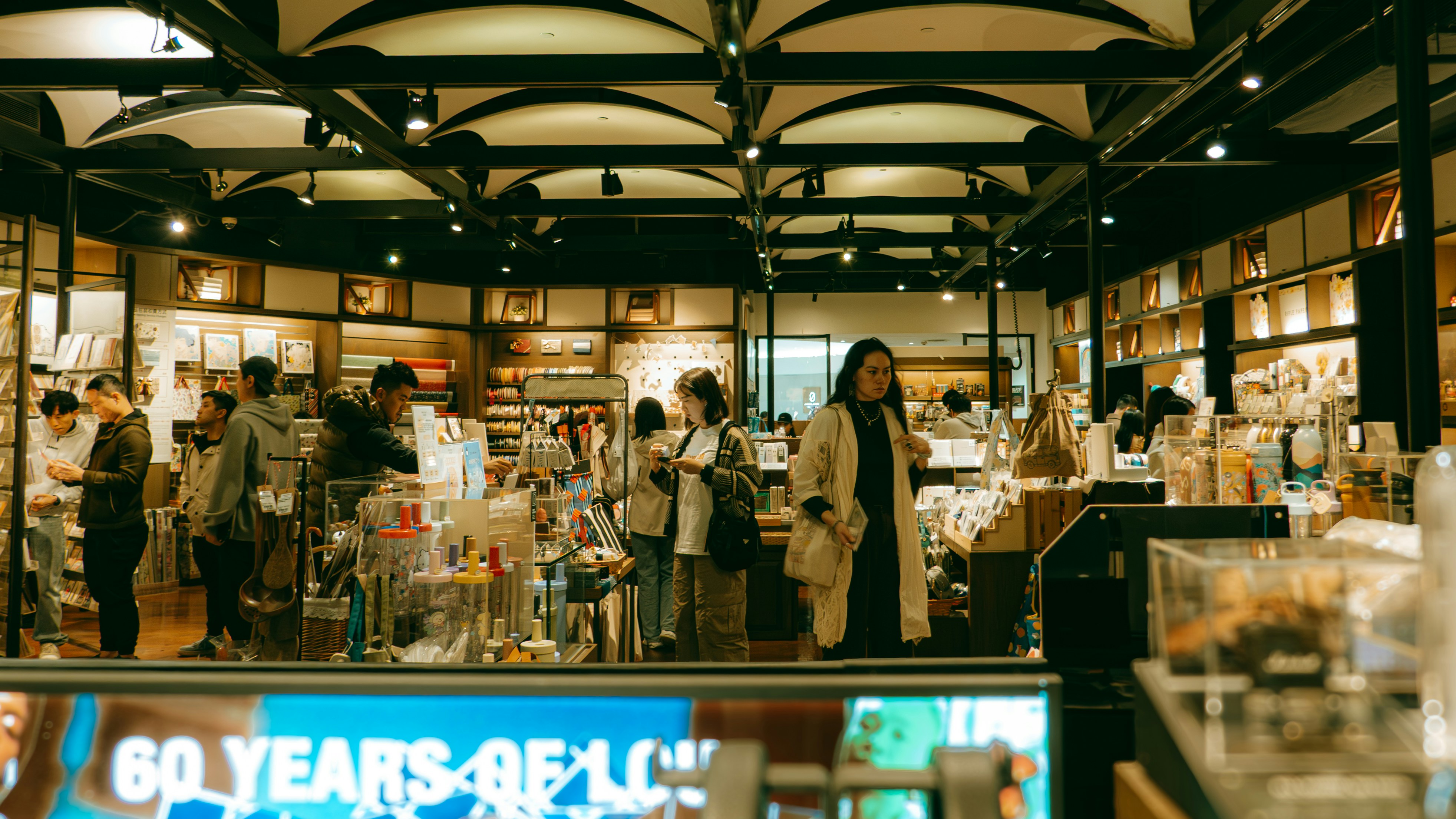 People browse inside a well-lit store.