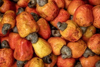 A pile of fresh, ripe cashew apples.