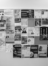 Bulletin board covered with many flyers.