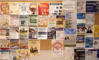 Bulletin board filled with various posters and flyers.