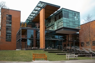 Modern building with glass and brick facade.