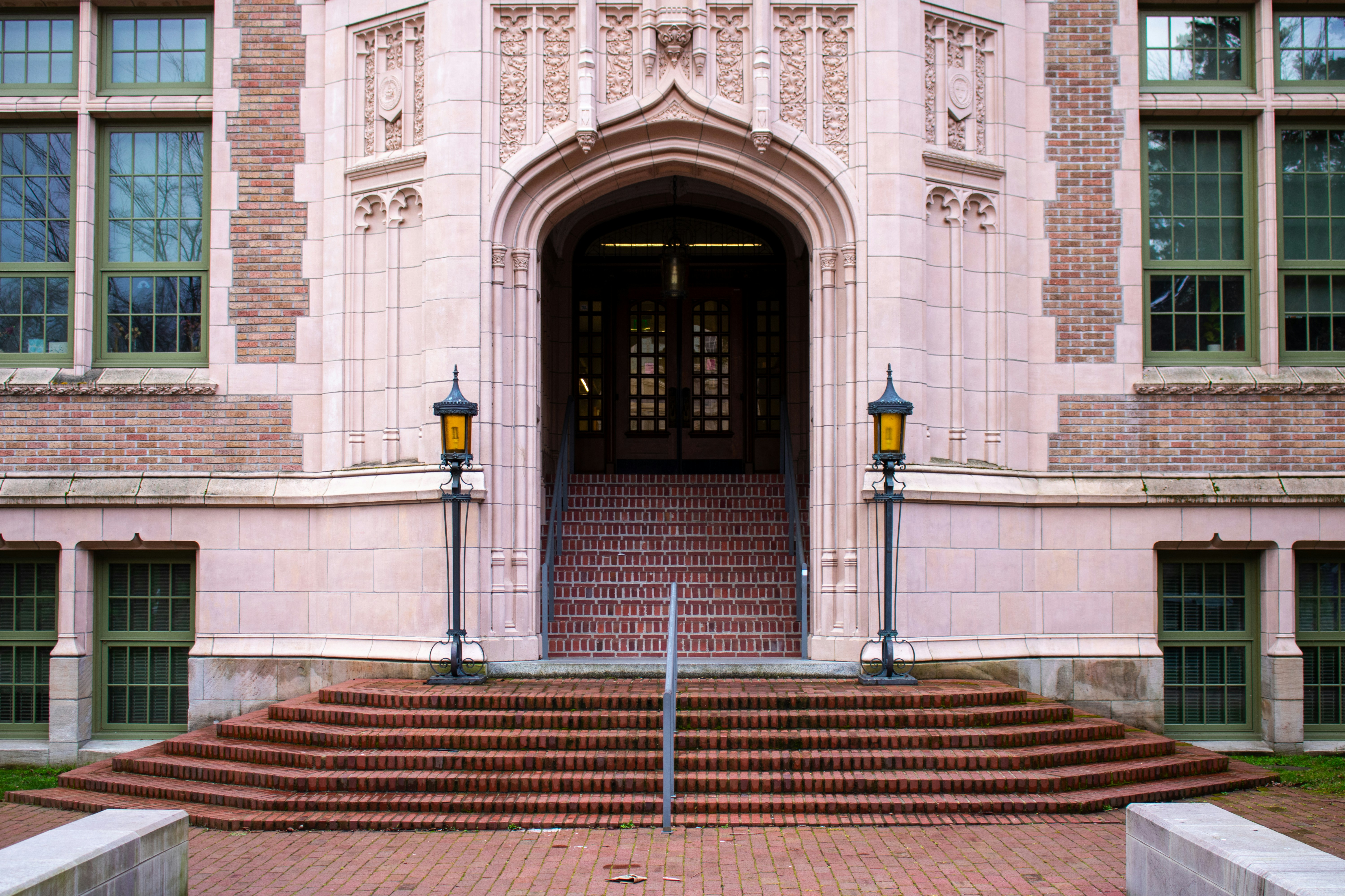 A grand arched doorway leads to a building.