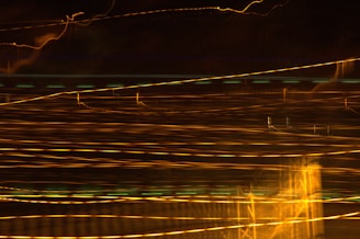 Light trails create an abstract, night cityscape.