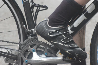 Cyclist's shoe clipped onto the pedal.