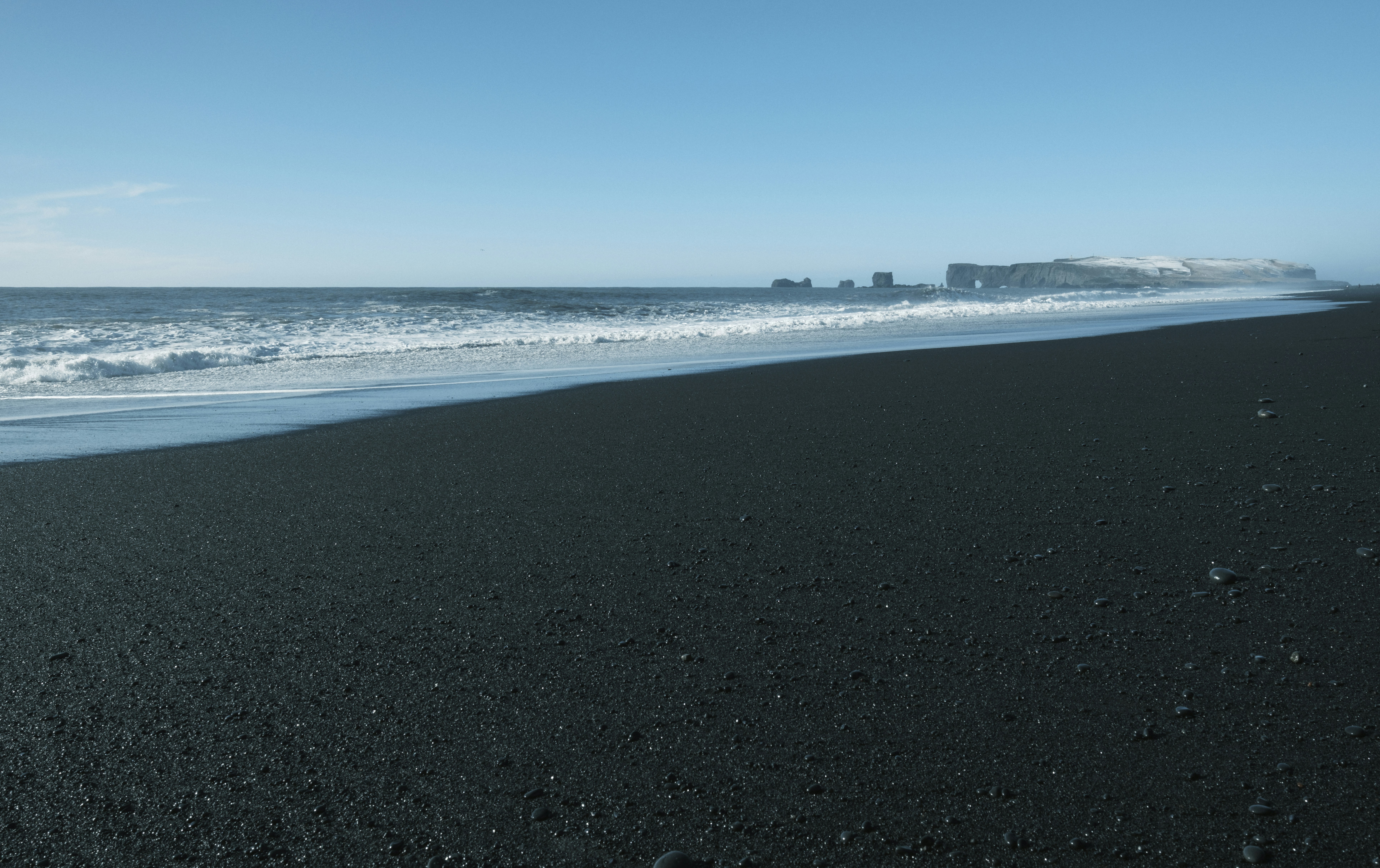 Black sand beach and the ocean.