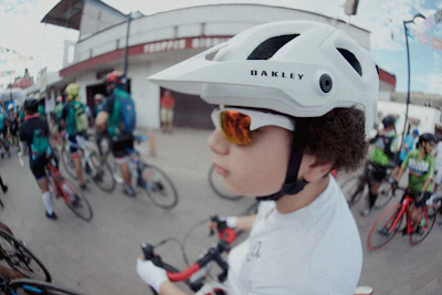 Cyclist ready to race, surrounded by fellow riders.