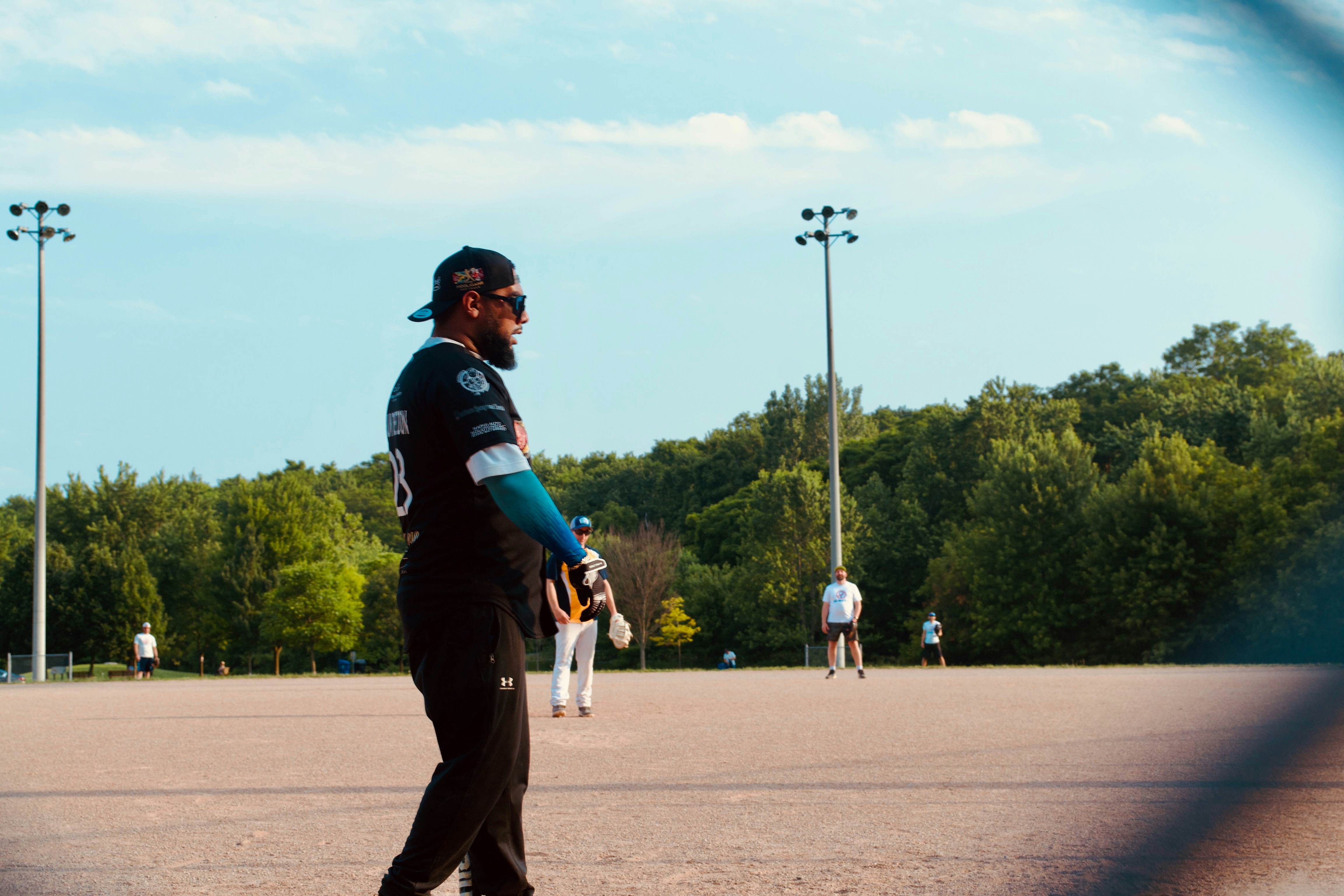 A baseball player stands on the field.