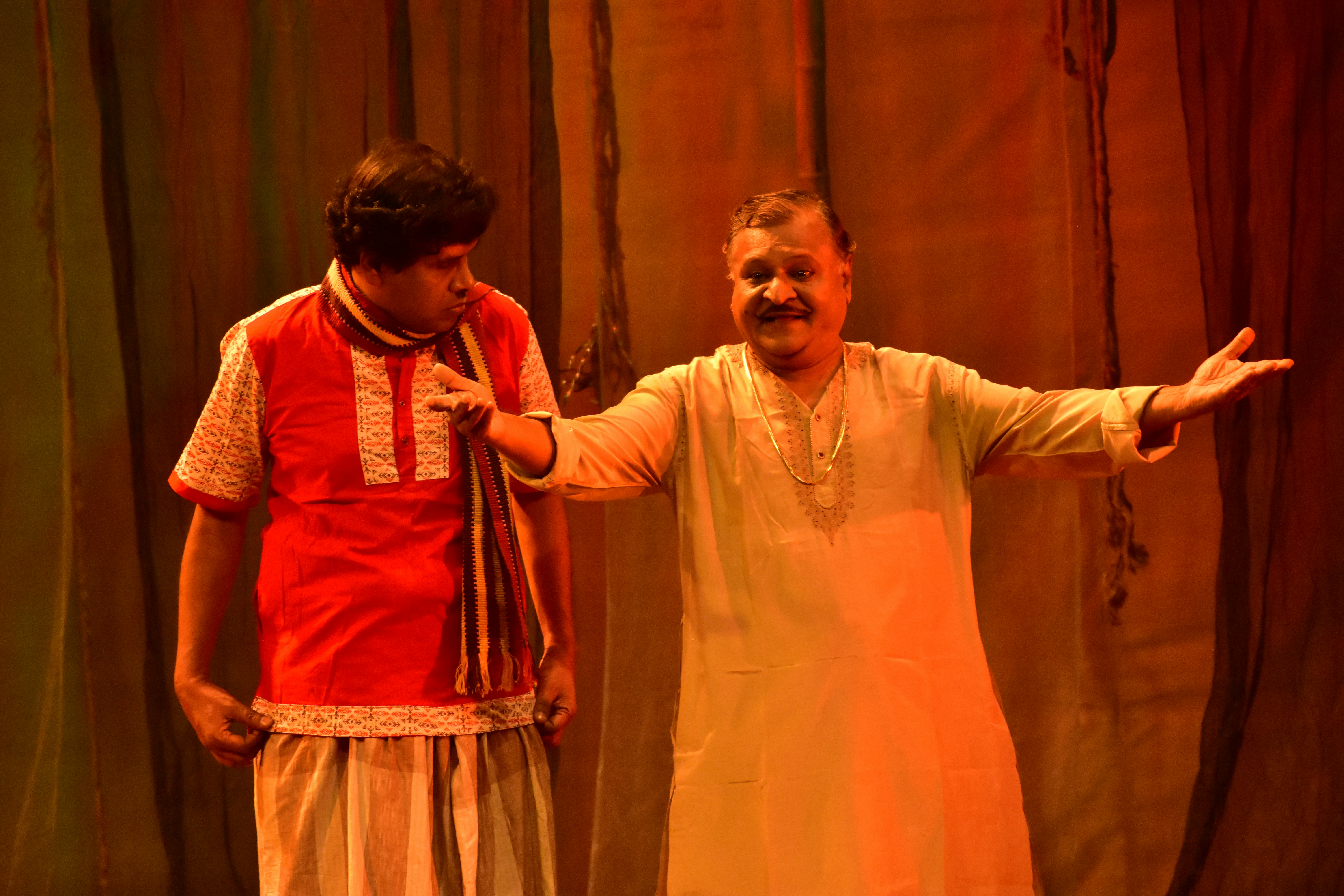 Two actors performing on stage