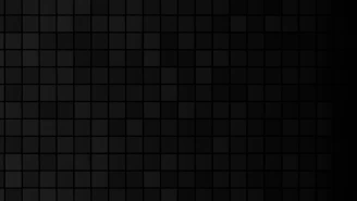 A dark background made of black squares.