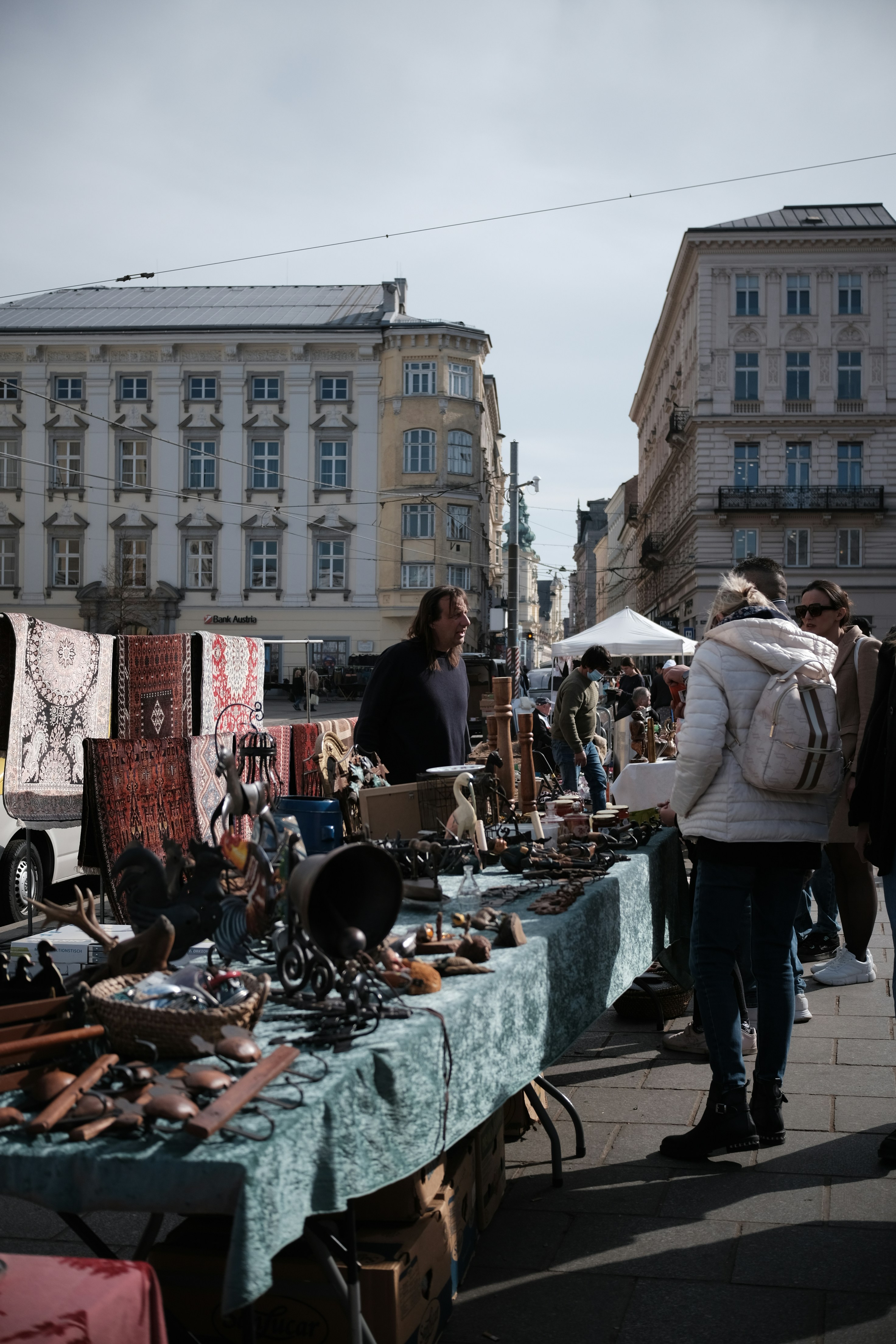 People browse antiques at a market.