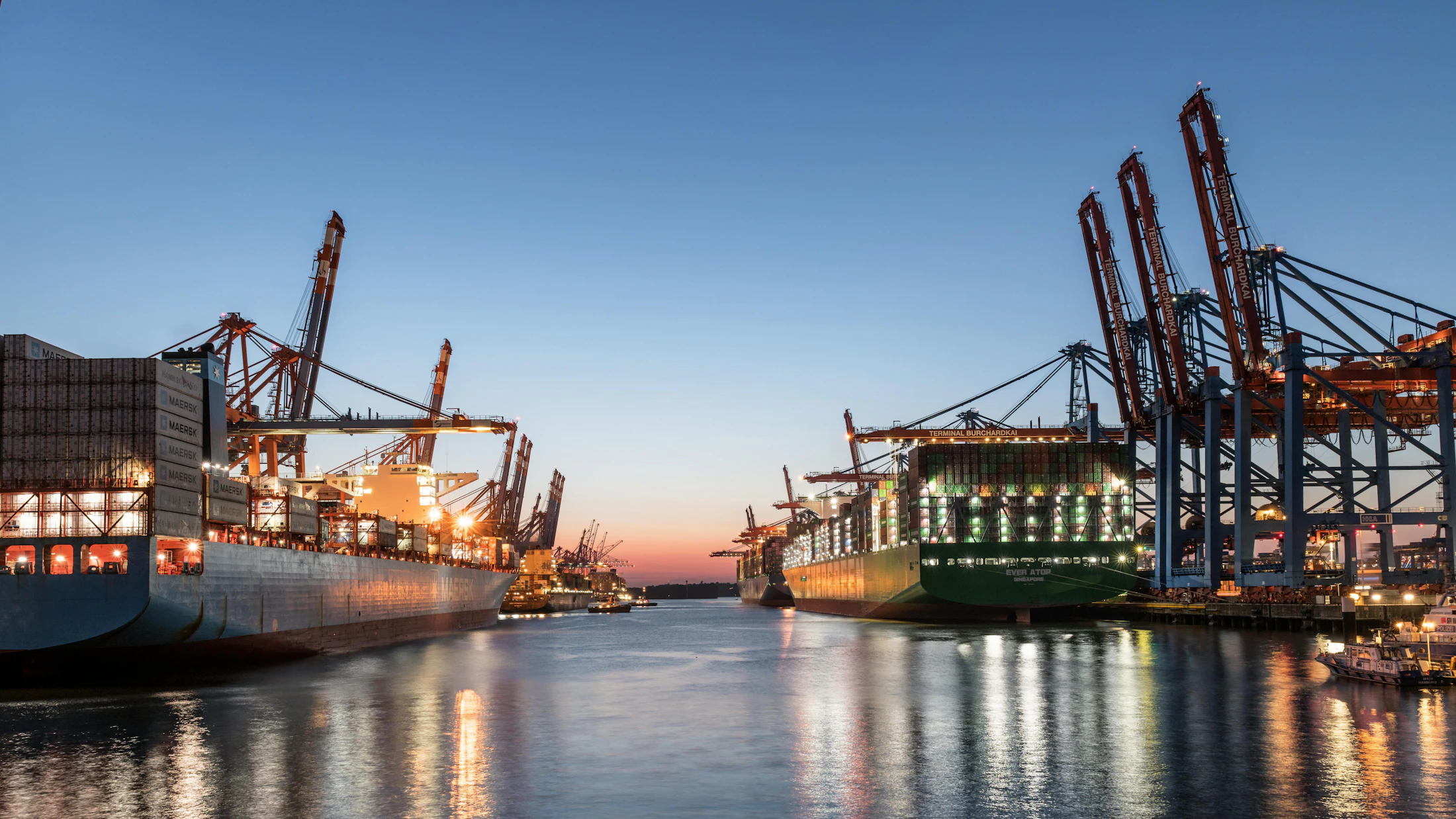 Container vessel and cranes at a global port