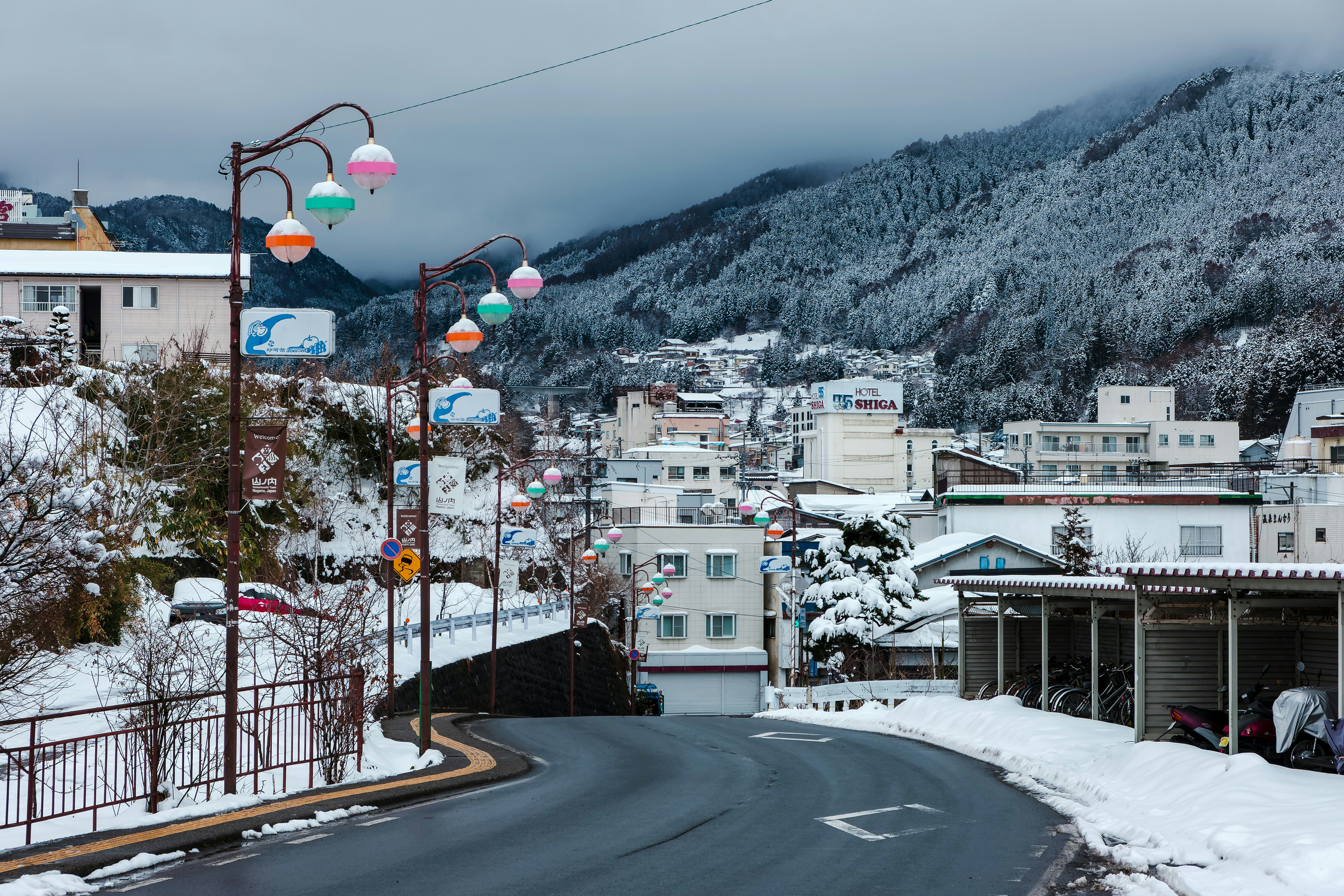 Snowy town nestled among snow-covered mountains.