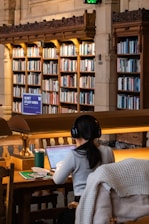 Woman studies in a quiet library study area.