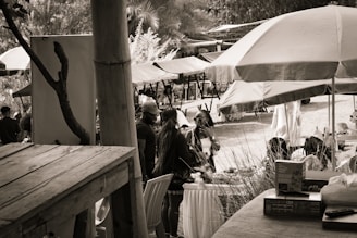 People are seen at an outdoor market.