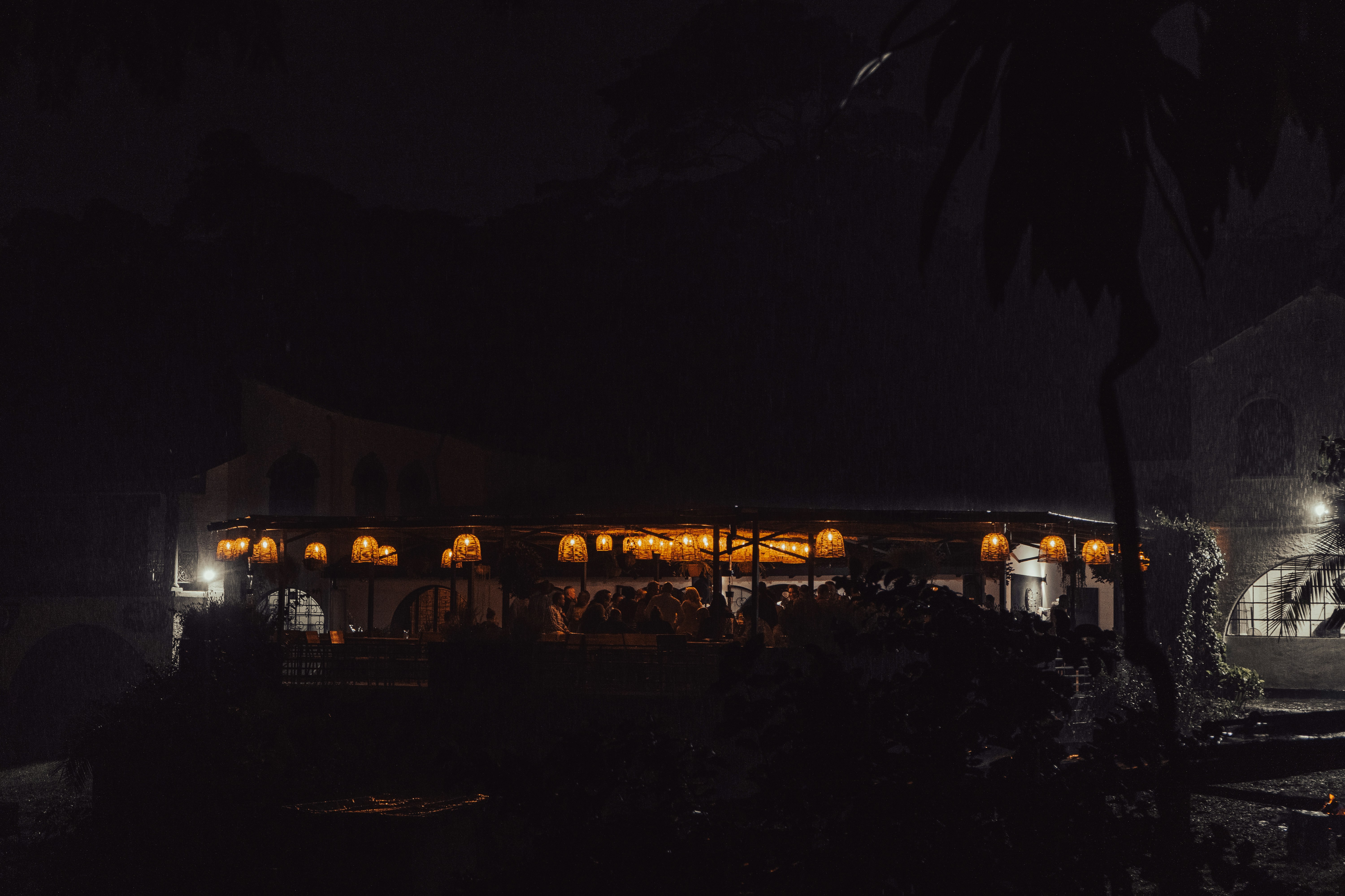 A night photo of a restaurant building at the organic farmers market in Karen. During the rain downpour