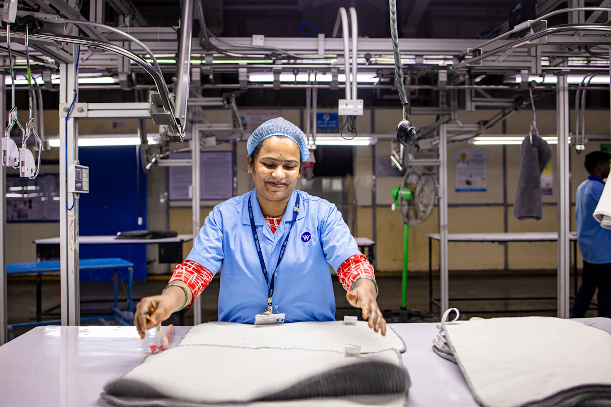 Worker inspecting textile quality in a factory
