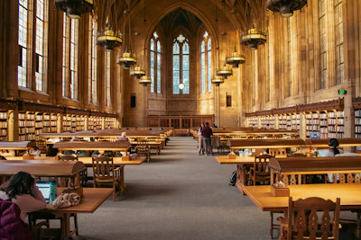 A grand library with high ceilings and bookshelves.