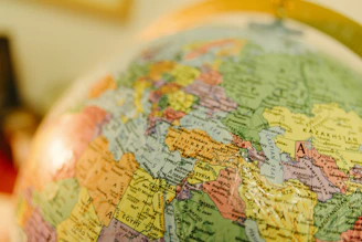 A globe showing political boundaries of countries.